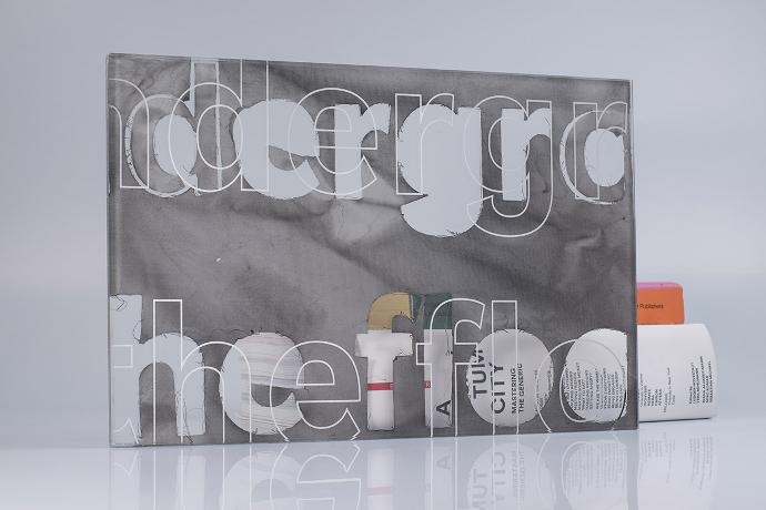Square piece of glass with white textile with letters and books on a neutral background
