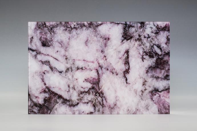 A square piece with a black-purple stone texture on a neutral background