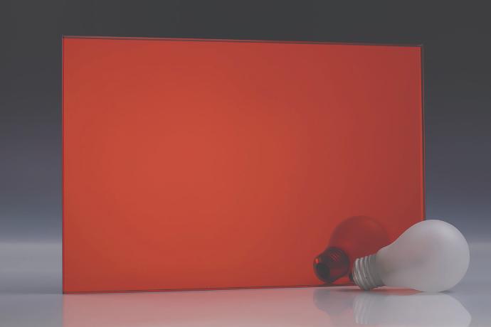 A square piece of a red mirror and a book on a neutral background