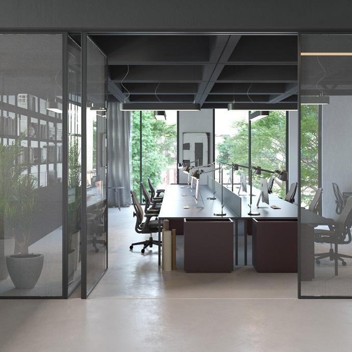 Office interior with glass folding doors, desks and computers.