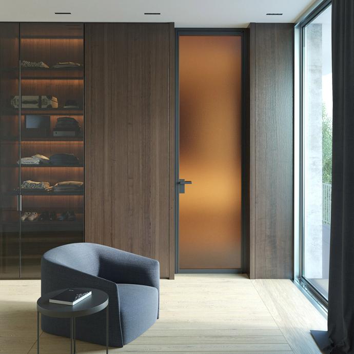 Modern interior with glass doors, armchair and coffee table.