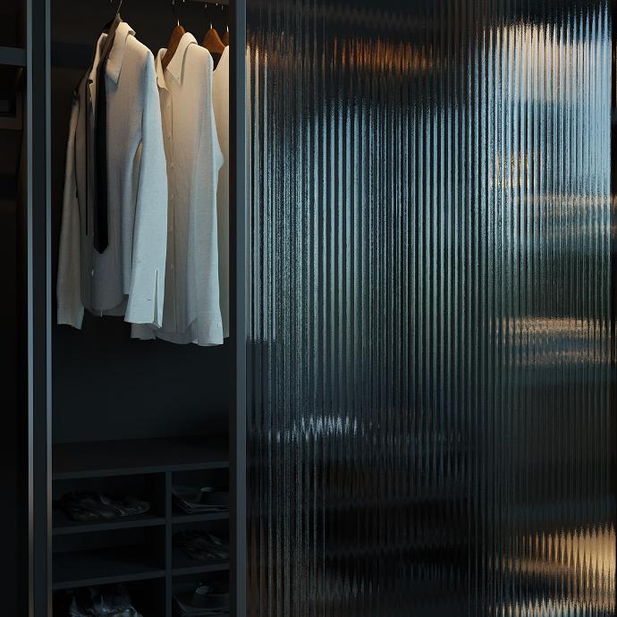 Detail of a walk-in closet with glass doors.