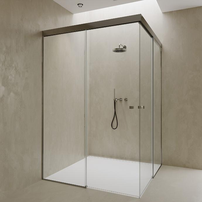 Corner shower cabin with double sliding glass doors.