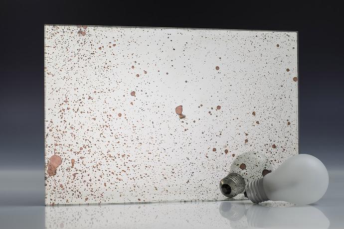 Silver copper stain - silver oxidation - antique mirror - sample A square mirror piece with copper stains and light bulbs on a neutral background